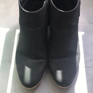 Black booties with buckle detail